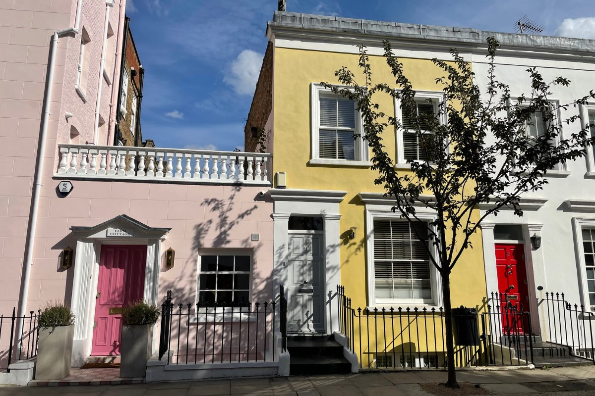 Photo of a pair of colourful terraced houses in Notting Hill.